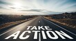 © Khadija - A wide, empty asphalt road stretches into the distance with bold white text reading TAKE ACTION painted on the pavement, surrounded by rocky terrain under a partly cloudy sky.