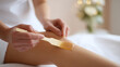 © A2Z AI  - Woman Apply Hair Removal Wax on Leg with Wooden Spatula for Smooth Skin at Beauty Salon or Home Self-Care Procedure Close Up View