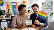 © Nina - Diverse Colleagues Celebrating Pride Month in Modern Office with Rainbow Flags and Pride at Work Signage