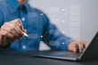 © Nirusmee - Decision tree analysis concept with businessperson using laptop, representing strategic planning, decision support, risk management, and data-driven business analysis.