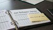 © faris - Detailed Loan Performance Overview Document with Sticky Note Reminder on Table Surface for Financial Analysis and Review