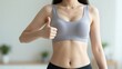 © CrazyJuke - Wellness endorsement: A person exhibits fitness through athletic attire, symbolizing the embodiment of a healthy lifestyle with a gesture of approval.