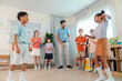 © chokniti - Back to school and education concept of classroom teacher children dance activity play group school education indoor