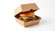 © IZZA  - Tasty beef burger with melted cheese in a partially closed craft paper delivery box, isolated on white.