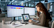 © Andrey Popov - Sales Manager Reviews Lead Scoring Dashboard On Laptop