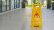 © Liada - Warning signs. Seal the yellow plastic sign with caution for wet floor
