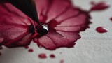 Deep Burgundy Ink Drop Spreading on Textured Paper