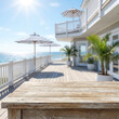 © Display Shop - Rustic Wooden Table on Sunny Tropical Beach House Deck Background for Summer Product Presentation Mockup