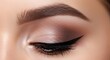 © Hena - Closeup of womans eye with makeup.