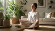 © XC Stock - Woman meditating at home with smartphone set aside