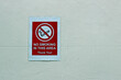 © bigal04uk - No Smoking In This Area Sign on a Painted Waiting Room Wall
