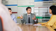 © fizkes - Businessman conducts professional meeting with multiethnic corporate team members in conference room, discussing deal or business strategy, presenting solutions, making decisions at office briefing