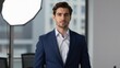 © mila103 - Man posing in navy suit in modern office studio portrait setup