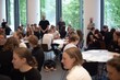 © Juan - Large group workshop session in modern meeting space