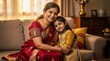 © PengAI - A joyful mother and daughter in traditional Indian attire share a warm embrace on a couch in a cozy, warmly-lit living room.