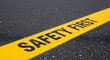 © Yassine - Bright yellow safety first text painted on dark asphalt road surface in a high angle photo