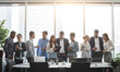 © Prostock-studio - Diverse business team discussing work during break, standing near window, copy space