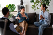 © lordn - Group therapy session with diverse adults talking and listening in a supportive environment, sharing emotions and experiences during a mental health counseling meeting