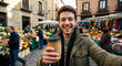 © Alexandr - Man holding coffee cup smiling in bustling local outdoor market street scene