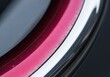 © Nyxoria - Close-up macro shot of a metallic red painted wheel rim with reflective chrome accents