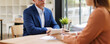 © David - Businessman having interview with female recruiter in modern office