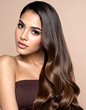 © Jackson - A woman with long, dark hair and a brown strapless top