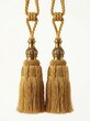 © markdefined - Pair of golden rope tassel tiebacks with ornate finials vector illustration