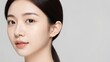 © CrazyJuke - Radiant Elegance: A close-up portrait unveils the exquisite beauty of a woman with a serene expression and flawless skin. Capturing the essence of purity and graceful charm.