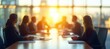© Ilja - Professionals Collaborating in Strategic Planning Session with Beautiful Sunset View as Background