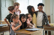 © DJ Creative Studio - Back To School Diverse Elementary School Students Standing Together In Classroom During International Education Learning Activity And Group Friendship Session