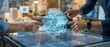 © FoxGrafy - Engineers engaging with a holographic 3D engine model on a high tech interactive table in a bright modern office.