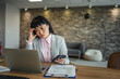© Miljan Živković - Businesswoman experiencing burnout and stress in office setting