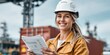 © NovaVision - Female engineer reviews plans in modern port setting