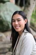 © Ranta Images - Beautiful smiling Thai woman professional entrepreneur in a tropical Phuket nature setting embodying success and confidence.