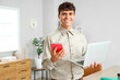 © Pixel-Shot - Male accountant with calculator and laptop in office