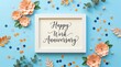© Ghulam - Elegant white picture frame displaying happy work anniversary text surrounded by paper craft flowers and colorful confetti on blue surface
