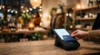 © Lucas - Customer making contactless payment with credit card at shop checkout counter