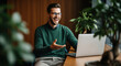 © Alexandr Peers - Video call consultation scene for remote coaching, online interview and virtual meeting use, showing a smiling man at a computer during a friendly call in an office setting for work service visuals