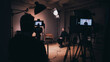 © Bonsales - Professional production team filming an interview in studio, recording video content for TV broadcast or online media