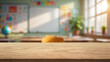 © Agil - Wooden table top and blur classroom interior with chalk board