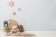 © New Africa - Child's chair and toys near light wall in room. Space for text