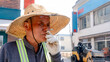 © ADDICTIVE STOCK - Asphalt paving worker on cigarette break during street repair