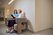 © Svitlana - Healthcare worker and patient discussing in medical office