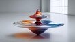 © Alfais - Vibrant Spinning Top Toy in Motion on a Clean Surface.