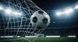 © TECH BD - Soccer ball hitting the back of the net during a professional night match at a stadium with bright floodlights