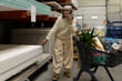 © Ivan Traimak - Senior woman is talking on phone and shopping for construction supplies in hardware store