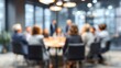 © Harry - Professional business team members sitting together around a wooden table during a corporate office meeting session