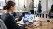 © Alexandr - Office worker using multi-factor authentication on phone and laptop