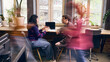 © Lustre Art Group  - Focused office workers having one on one business conversation in coworking space. Concept of mentoring, feedback session, client briefing, HR meeting, startup coaching, and team communication.