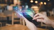 © Rafli - A person's hands interacting with a smartphone displaying a holographic e-commerce interface with a shopping cart and data trends, symbolizing online shopping and digital business.